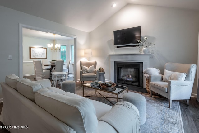 347 Stone Gate Dr, Greenville, NC 27858 - living room with a chandelier, wood finished floors, lofted ceiling, a glass covered fireplace, and recessed lighting