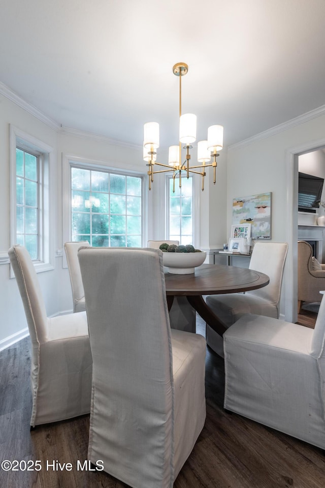 347 Stone Gate Dr, Greenville, NC 27858 - dining area featuring a chandelier, ornamental molding, wood finished floors, and healthy amount of natural light