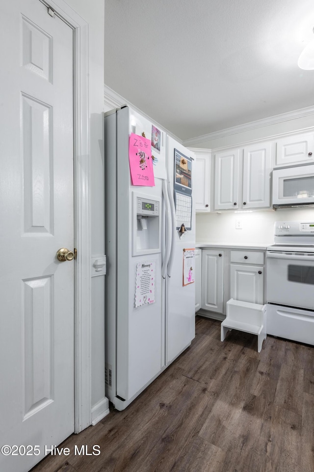 347 Stone Gate Dr, Greenville, NC 27858 - kitchen featuring white appliances, white cabinetry, dark wood finished floors, and light countertops