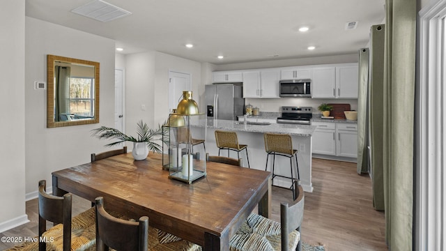 205 Wood St, La Grange, NC 28551 - dining area with light wood-style flooring and recessed lighting
