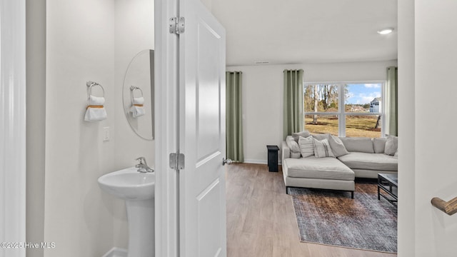205 Wood St, La Grange, NC 28551 - bathroom featuring baseboards and wood finished floors