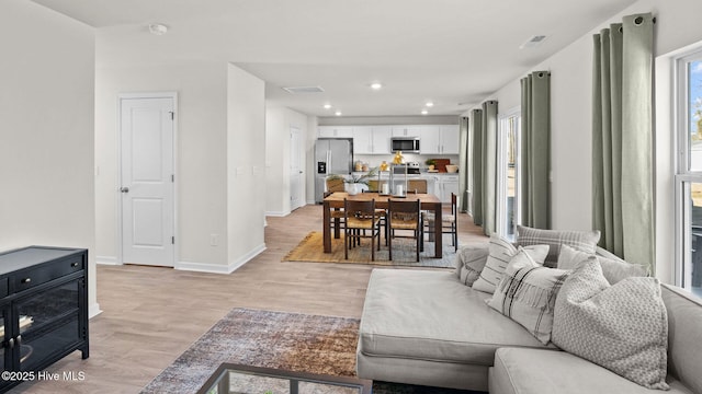 205 Wood St, La Grange, NC 28551 - living area featuring light wood-style flooring and recessed lighting