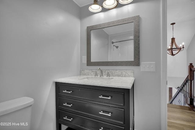 2971 Penderlea Hwy, Burgaw, NC 28425 - bathroom with vanity, a chandelier, wood finished floors, and ornamental molding