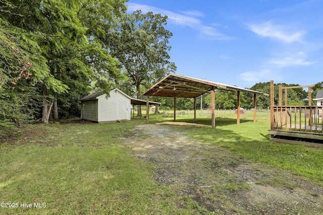 2971 Penderlea Hwy, Burgaw, NC 28425 - view of green lawn with a detached carport, an outbuilding, and a deck
