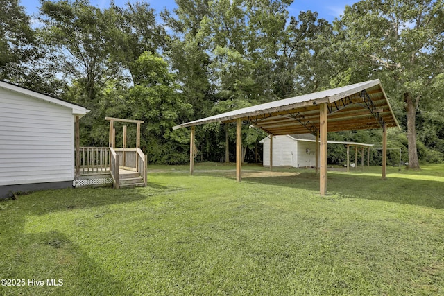 2971 Penderlea Hwy, Burgaw, NC 28425 - view of green lawn featuring a wooden deck and view of wooded area