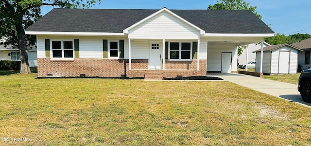 204 Mercer St, Goldsboro, NC 27530 - view of front of property featuring concrete driveway, a shed, brick siding, and a carport