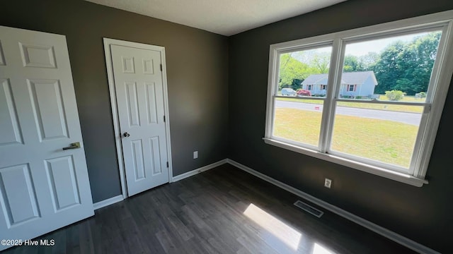 204 Mercer St, Goldsboro, NC 27530 - empty room featuring dark wood-type flooring and baseboards