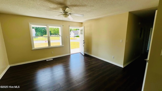 204 Mercer St, Goldsboro, NC 27530 - empty room with a textured ceiling, dark wood finished floors, and a ceiling fan