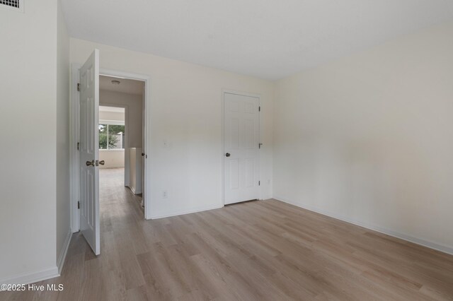 514 Cobblestone Dr, Wilmington, NC 28405 - unfurnished bedroom with light wood-style floors and baseboards