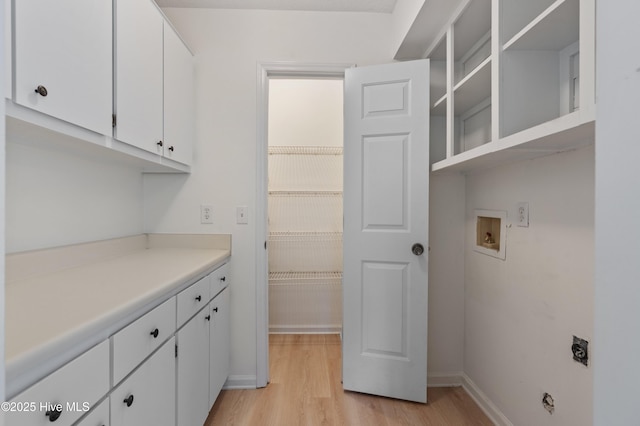 514 Cobblestone Dr, Wilmington, NC 28405 - washroom featuring light wood-type flooring, washer hookup, cabinet space, and hookup for an electric dryer