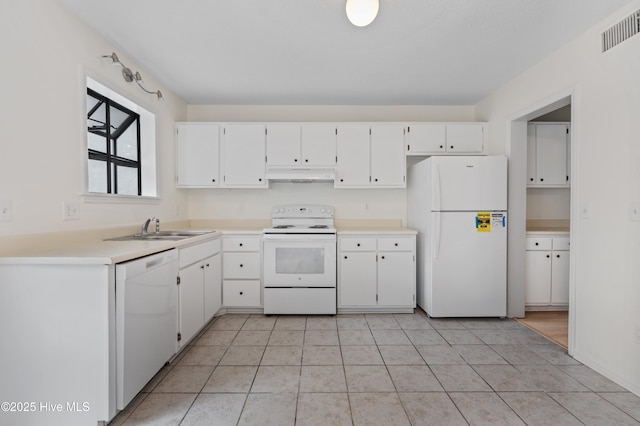 514 Cobblestone Dr, Wilmington, NC 28405 - kitchen featuring white appliances, under cabinet range hood, white cabinetry, and light countertops