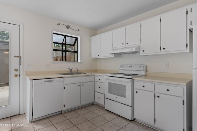 514 Cobblestone Dr, Wilmington, NC 28405 - kitchen with white appliances, under cabinet range hood, plenty of natural light, and white cabinets