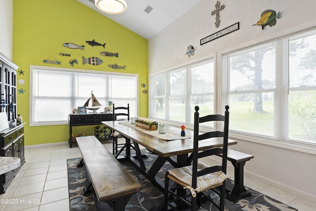 102 Crooked Gulley Cir, Sunset Beach, NC 28468 - dining area with high vaulted ceiling, plenty of natural light, and light tile patterned flooring