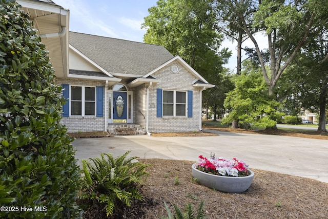 102 Crooked Gulley Cir, Sunset Beach, NC 28468 - view of front of property featuring brick siding and roof with shingles