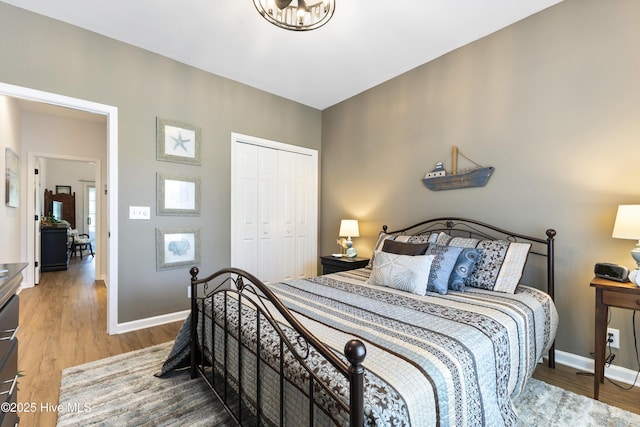 102 Crooked Gulley Cir, Sunset Beach, NC 28468 - bedroom featuring wood finished floors and a closet