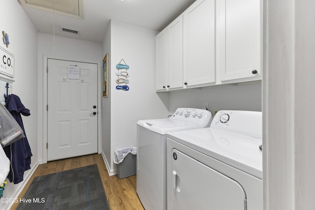 102 Crooked Gulley Cir, Sunset Beach, NC 28468 - laundry room with attic access, washer and clothes dryer, wood finished floors, and cabinet space