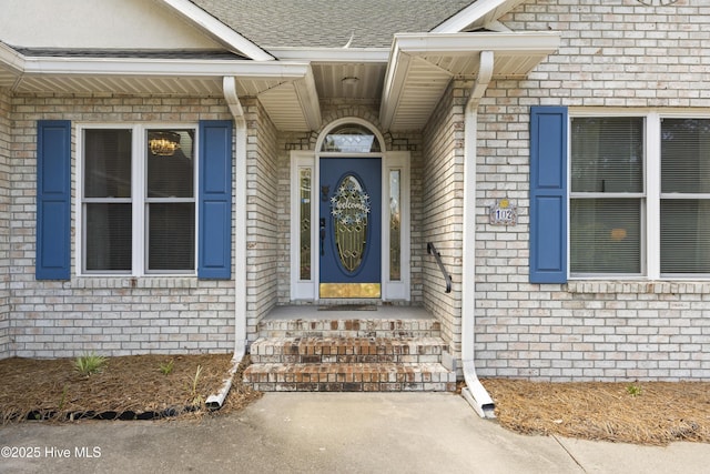 102 Crooked Gulley Cir, Sunset Beach, NC 28468 - doorway to property featuring brick siding