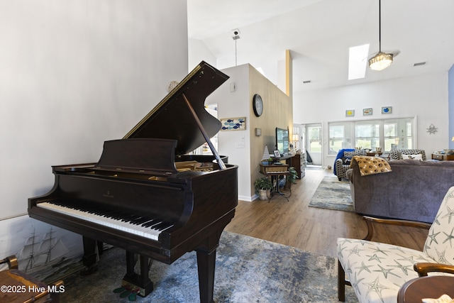 102 Crooked Gulley Cir, Sunset Beach, NC 28468 - sitting room featuring high vaulted ceiling and wood finished floors