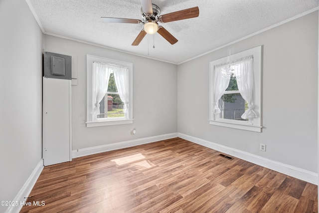 302 Roanoke Trl, Edenton, NC 27932 - empty room with a textured ceiling, wood finished floors, crown molding, and ceiling fan