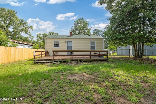 302 Roanoke Trl, Edenton, NC 27932 - rear view of house with a deck, a fenced backyard, and a chimney