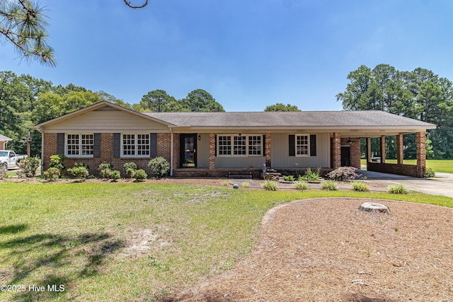 108 Perry Dr, Goldsboro, NC 27530 - ranch-style home with a front lawn, brick siding, driveway, and a carport