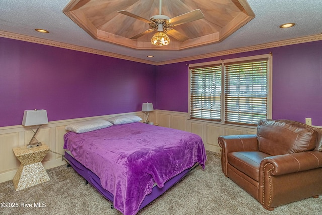 108 Perry Dr, Goldsboro, NC 27530 - bedroom with carpet, wainscoting, a textured ceiling, ornamental molding, and a decorative wall
