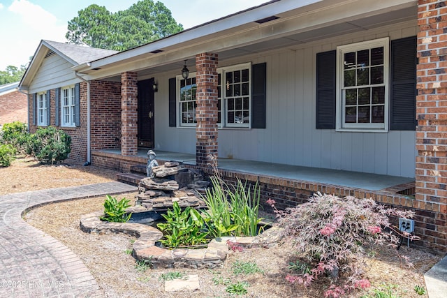 108 Perry Dr, Goldsboro, NC 27530 - view of front of home with covered porch and brick siding