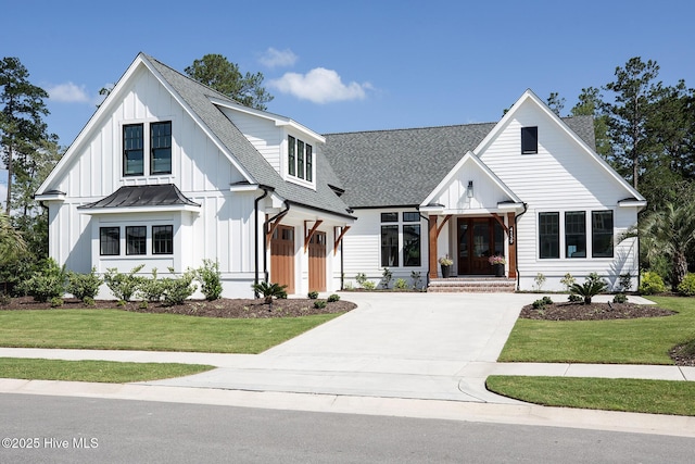 4139 Cobleskill Dr, Leland, NC 28451 - modern inspired farmhouse with board and batten siding, roof with shingles, concrete driveway, and a front yard