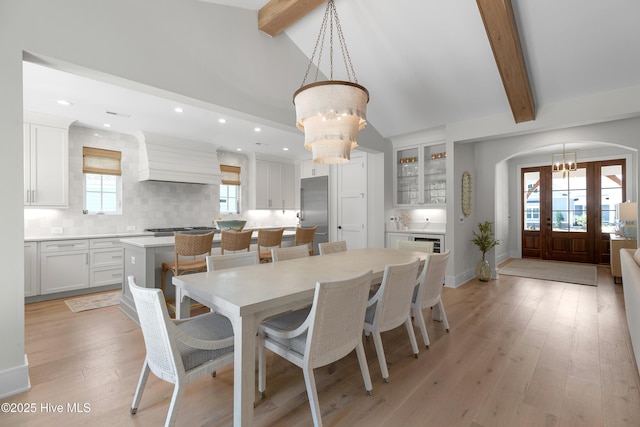 4139 Cobleskill Dr, Leland, NC 28451 - dining area with a chandelier, arched walkways, recessed lighting, and light wood finished floors