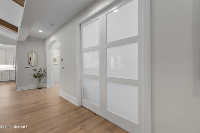 4139 Cobleskill Dr, Leland, NC 28451 - hall featuring arched walkways, recessed lighting, and light wood finished floors
