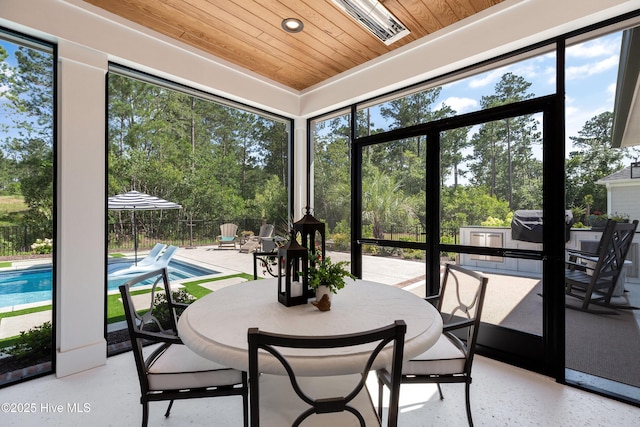 4139 Cobleskill Dr, Leland, NC 28451 - sunroom with wood ceiling, plenty of natural light, recessed lighting, outdoor dining space, and view of wooded area
