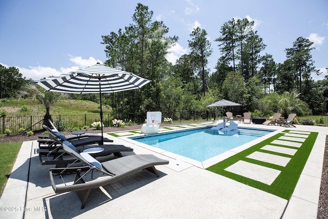 4139 Cobleskill Dr, Leland, NC 28451 - view of swimming pool with a patio area and a fenced backyard