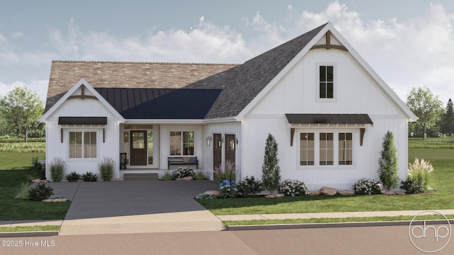 135 Forest Walk SW, Sunset Beach, NC 28468 - modern inspired farmhouse with a standing seam roof, a metal roof, and a front lawn
