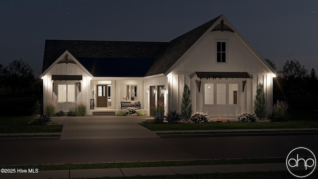 135 Forest Walk SW, Sunset Beach, NC 28468 - modern farmhouse style home with board and batten siding, a shingled roof, a porch, and concrete driveway