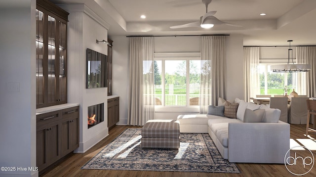135 Forest Walk SW, Sunset Beach, NC 28468 - living room with plenty of natural light, a raised ceiling, a ceiling fan, and recessed lighting