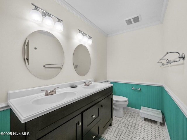 1896 New River Inlet Rd Unit 1310, North Topsail Beach, NC 28460 - full bathroom featuring double vanity, a wainscoted wall, and ornamental molding