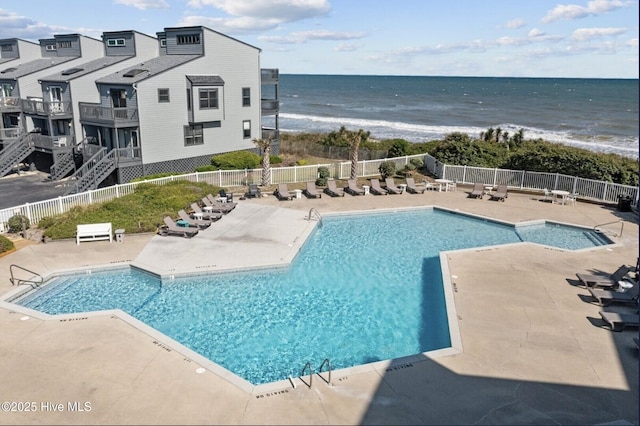 1896 New River Inlet Rd Unit 1310, North Topsail Beach, NC 28460 - community pool with a patio and view of water and beach