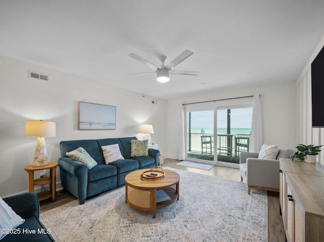 1896 New River Inlet Rd Unit 1310, North Topsail Beach, NC 28460 - living room with light wood-style flooring and ceiling fan