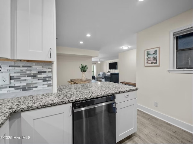 1896 New River Inlet Rd Unit 1310, North Topsail Beach, NC 28460 - kitchen with dishwasher, white cabinets, light wood-style floors, light stone counters, and recessed lighting