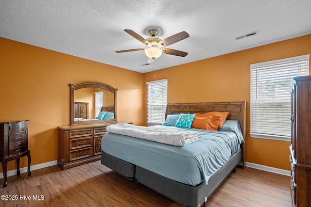 1005 Pleasant Dale Dr, Wilmington, NC 28412 - bedroom featuring wood finished floors, a textured ceiling, and ceiling fan