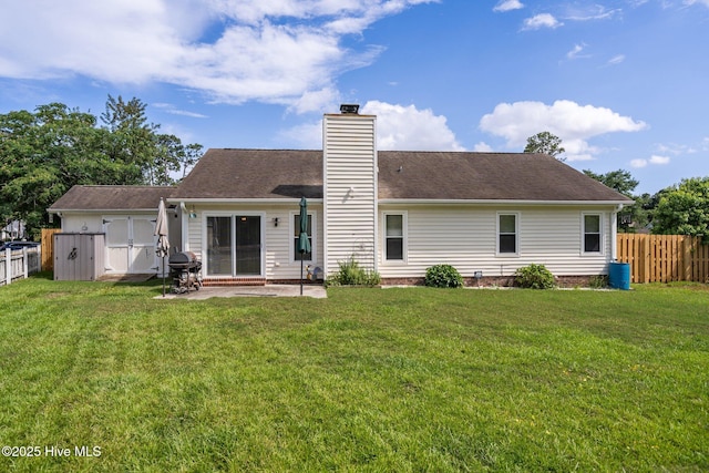 1005 Pleasant Dale Dr, Wilmington, NC 28412 - back of house featuring a chimney and a patio area