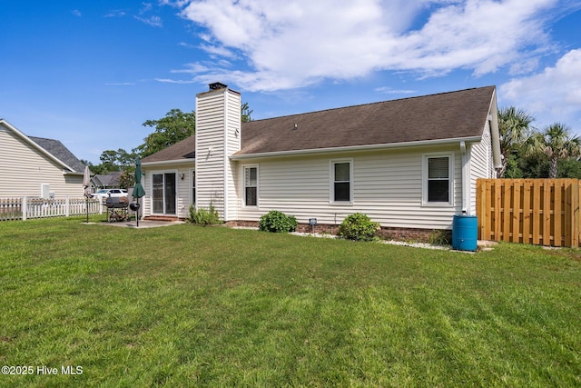1005 Pleasant Dale Dr, Wilmington, NC 28412 - rear view of property featuring a chimney, a patio area, and roof with shingles