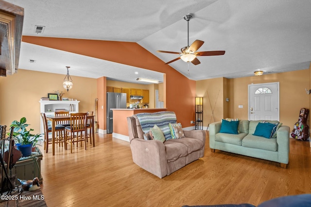 1005 Pleasant Dale Dr, Wilmington, NC 28412 - living room with light wood finished floors, vaulted ceiling, and ceiling fan