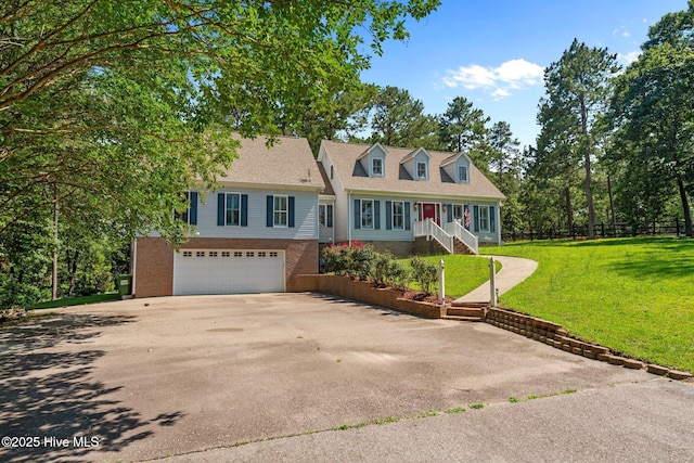 7405 Chickadee Ct, Sanford, NC 27332 - cape cod home with concrete driveway and an attached garage