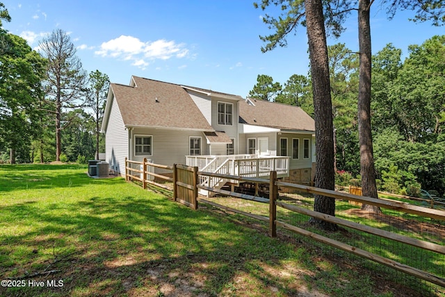 7405 Chickadee Ct, Sanford, NC 27332 - back of property featuring a deck and a shingled roof
