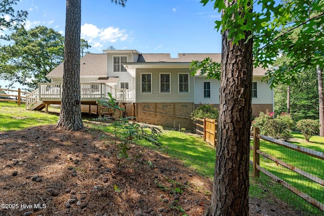 7405 Chickadee Ct, Sanford, NC 27332 - rear view of house featuring a deck, stairs, and roof with shingles