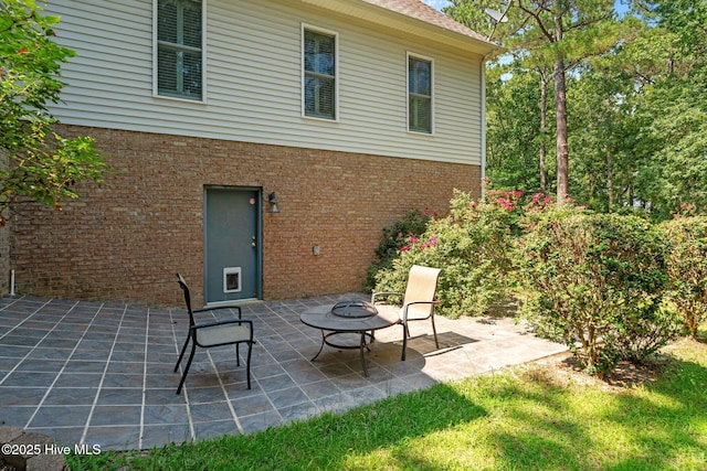7405 Chickadee Ct, Sanford, NC 27332 - view of patio featuring an outdoor fire pit