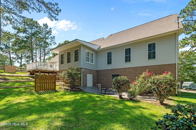 7405 Chickadee Ct, Sanford, NC 27332 - back of house with brick siding, a patio area, and roof with shingles