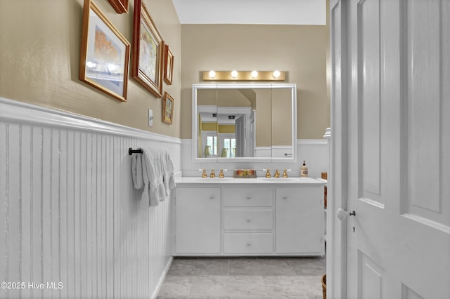 415 S 3rd St, Wilmington, NC 28401 - full bath featuring a wainscoted wall and double vanity