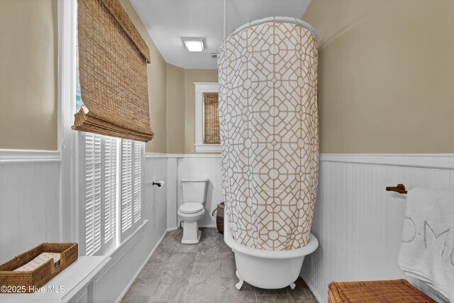 415 S 3rd St, Wilmington, NC 28401 - full bath with a wainscoted wall and a freestanding bath